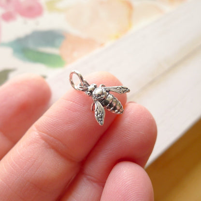 Sterling silver bee charm with realistic detailing, perfect for adding a nature-inspired touch to necklaces, bracelets, or custom jewelry designs